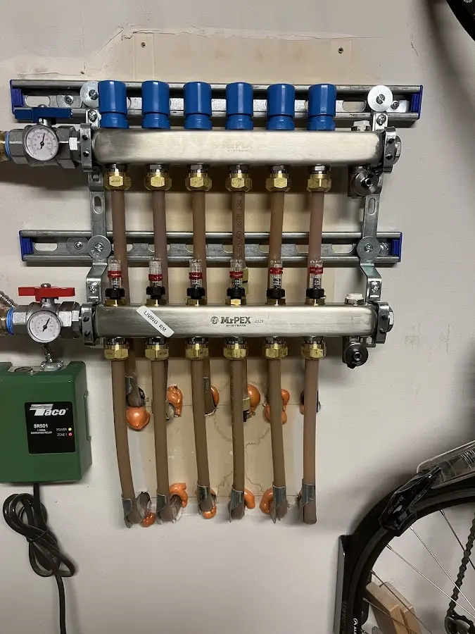 Plumber performing Gas Line Installation at a residential property in Fairfax